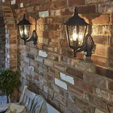 Outdoor lantern illuminating a garden at night